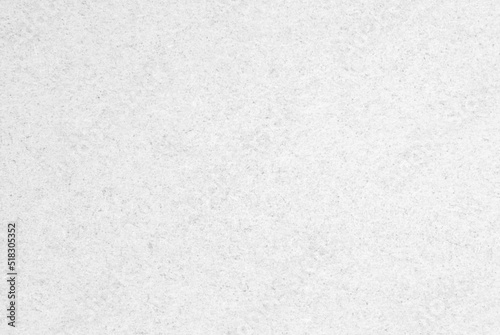 A sheet of white recycled paper or cardboard texture as background