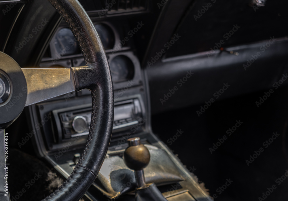 Obraz premium Vintage classic car interior. Steering wheel and dashboard