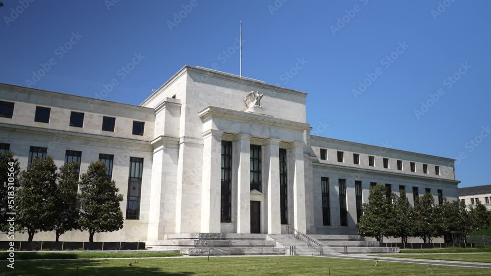 Trucking view of front of the federal reserve government Eccles building in Washington, DC where inflation financial policy is made.