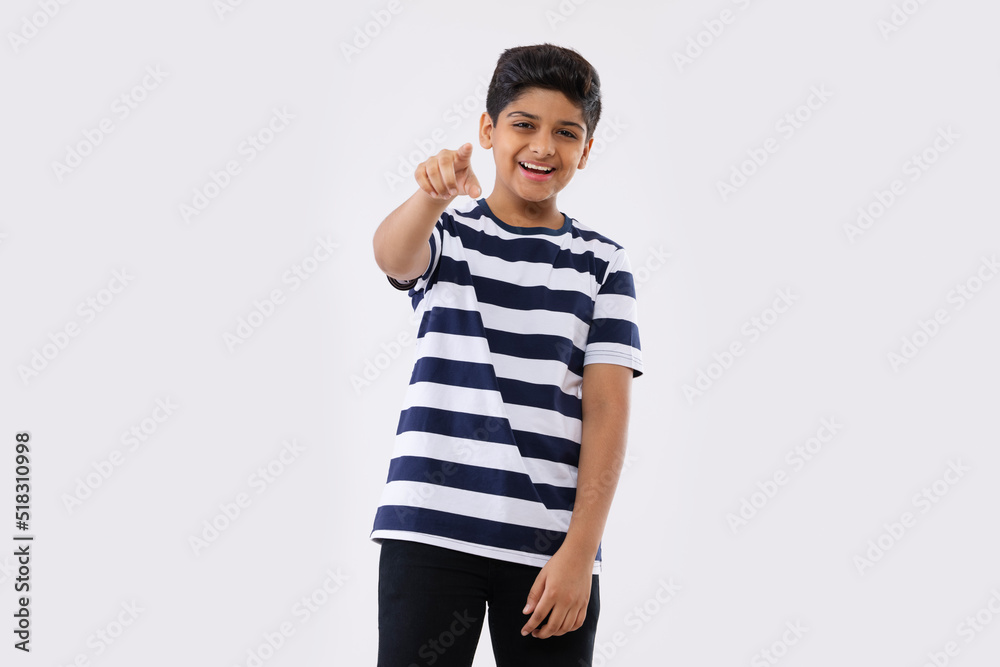Portrait of a cheerful boy gesturing against white background Portrait of a cheerful boy gesturing against white background