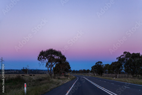 rural country road in low light - driving in hazardous conditions