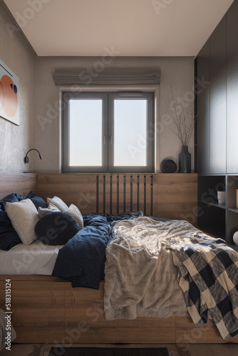 Small and cozy bedroom with window