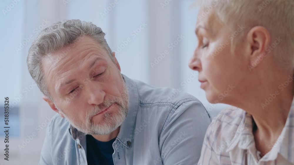 Sad couple calculating budget, feeling stressed about financial situation Sad couple calculating budget, feeling stressed about financial situation
