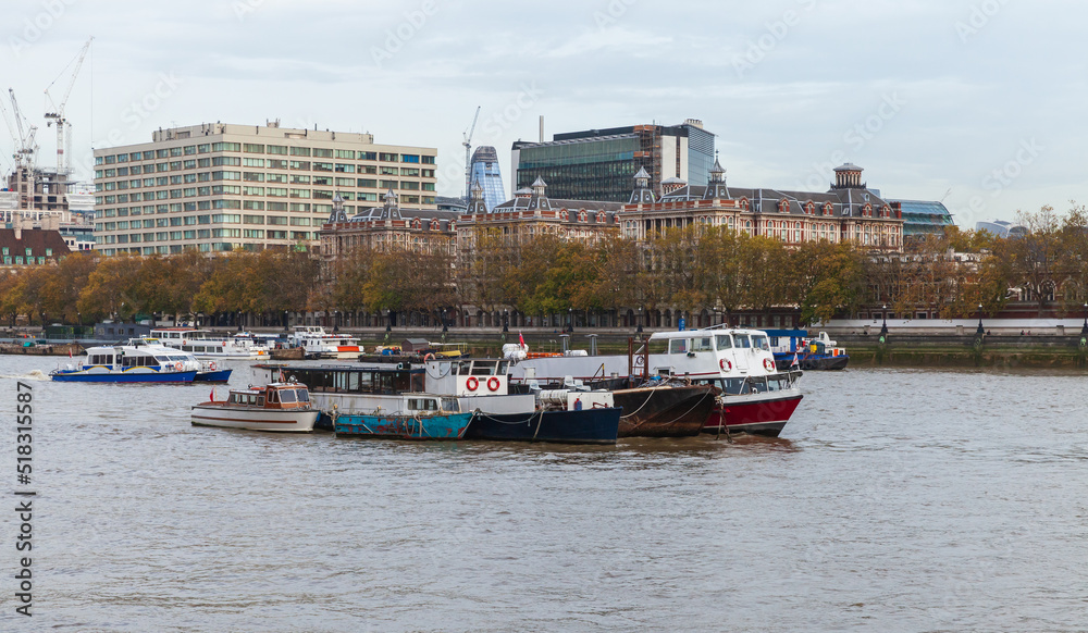 Boats moored on Thames River near St Thomas Hospital