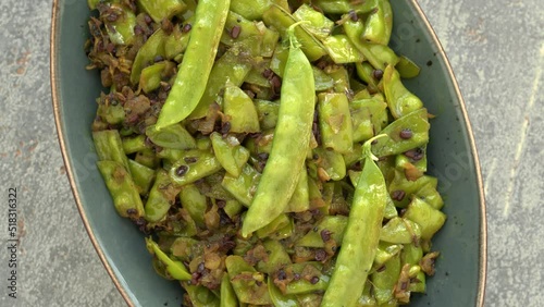 Sugar peas poriyal (sugar peas thoran) meal. Asian cuisine style food. Table spin. photo