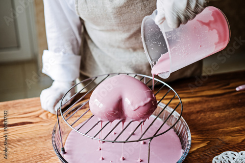 Mousse Cake. Mirror Glaze Cake. Process of making heart shape mousse cake with pink mirror glaze