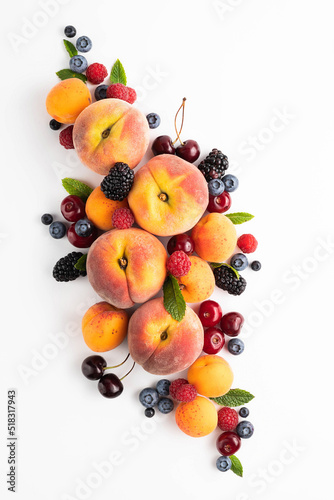Peaches, cherries, raspberries, blueberries, blackberries, peaches on a white background.