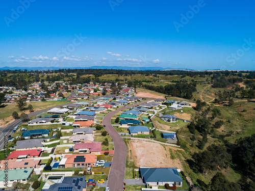 Looking down a street full of family homes in country town
