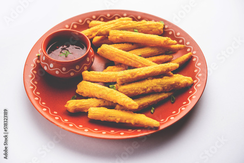 Crispy fried baby corn pakoda, pakora  or Baby corn fritters served with ketchup, Indian food photo