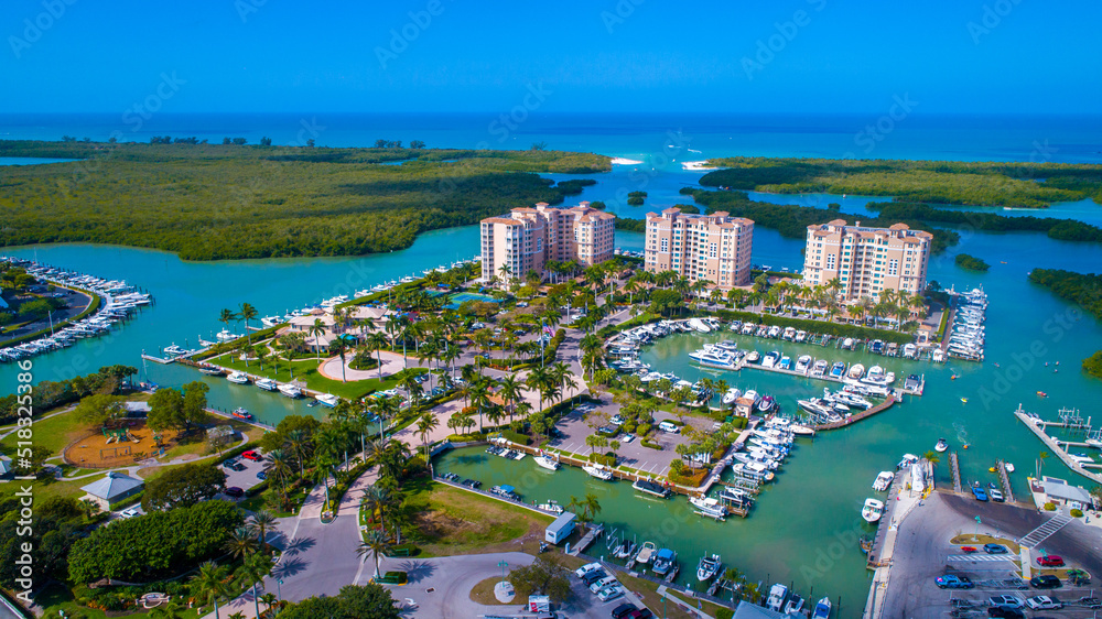 Aerial Drone Photo Showing a Pass from the Bay to the Gulf of Mexico in Naples, Florida with Real Estate in the Foreground