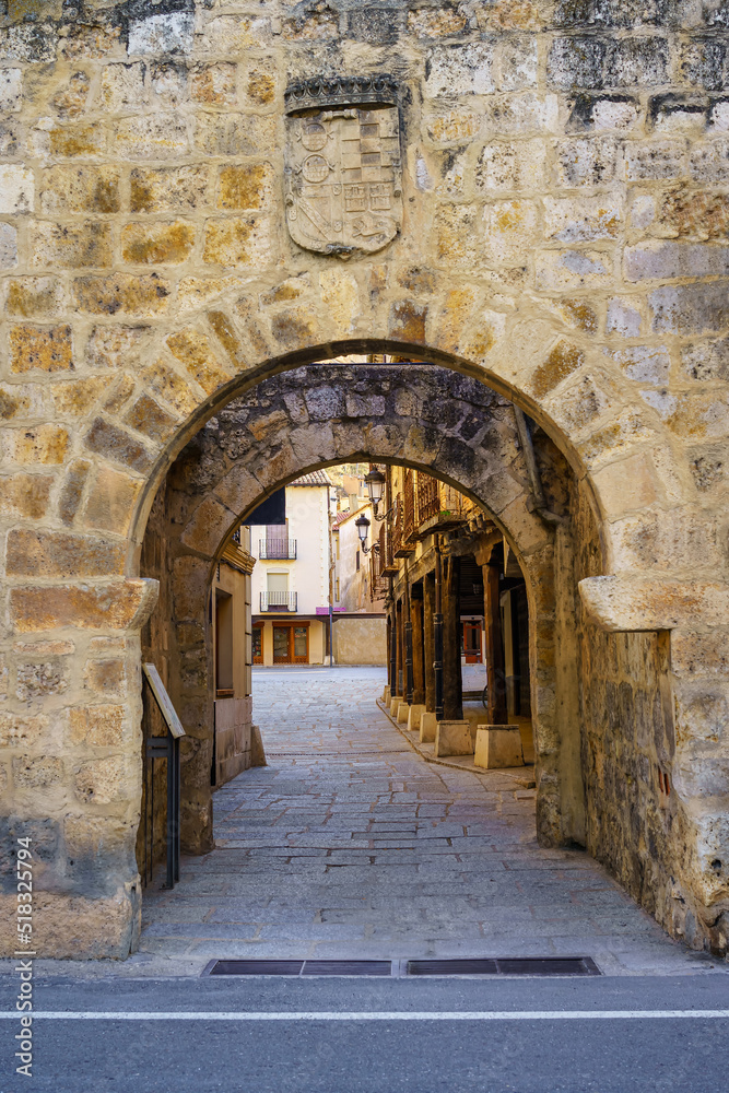 Entrance arch in the medieval wall of the small picturesque village of San Esteban de Gormaz, Castilla Leon.