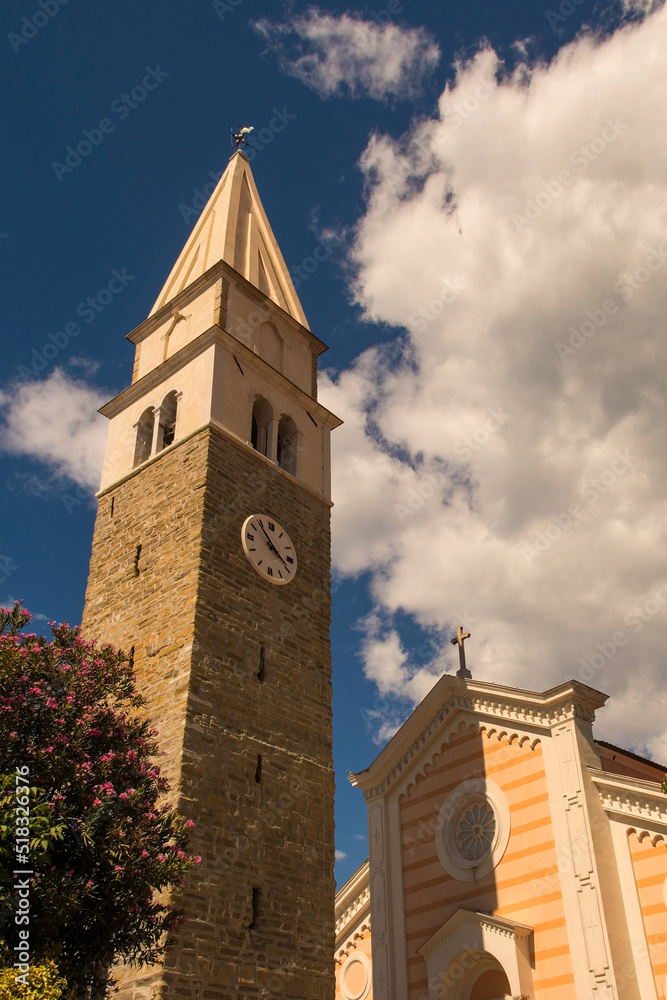 The historic 16th century St Maurus's Parish Church with its detached bell tower in Izola, Slovenia
