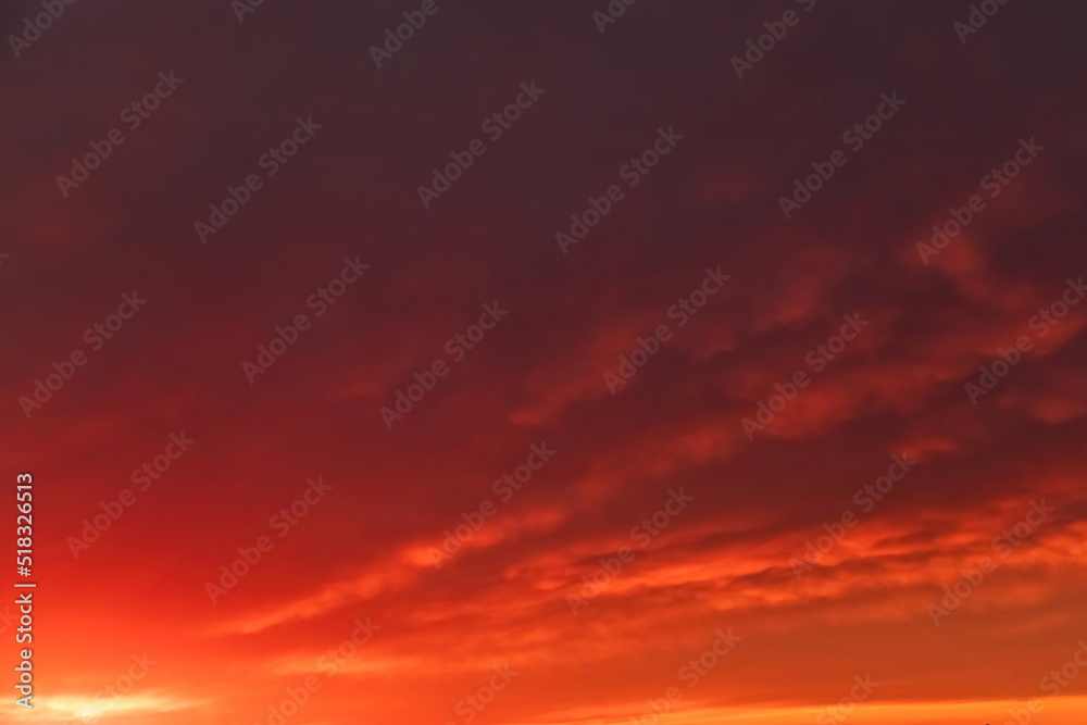 Beautiful clouds at sunset. Dramatic sky in sun. Natural background.