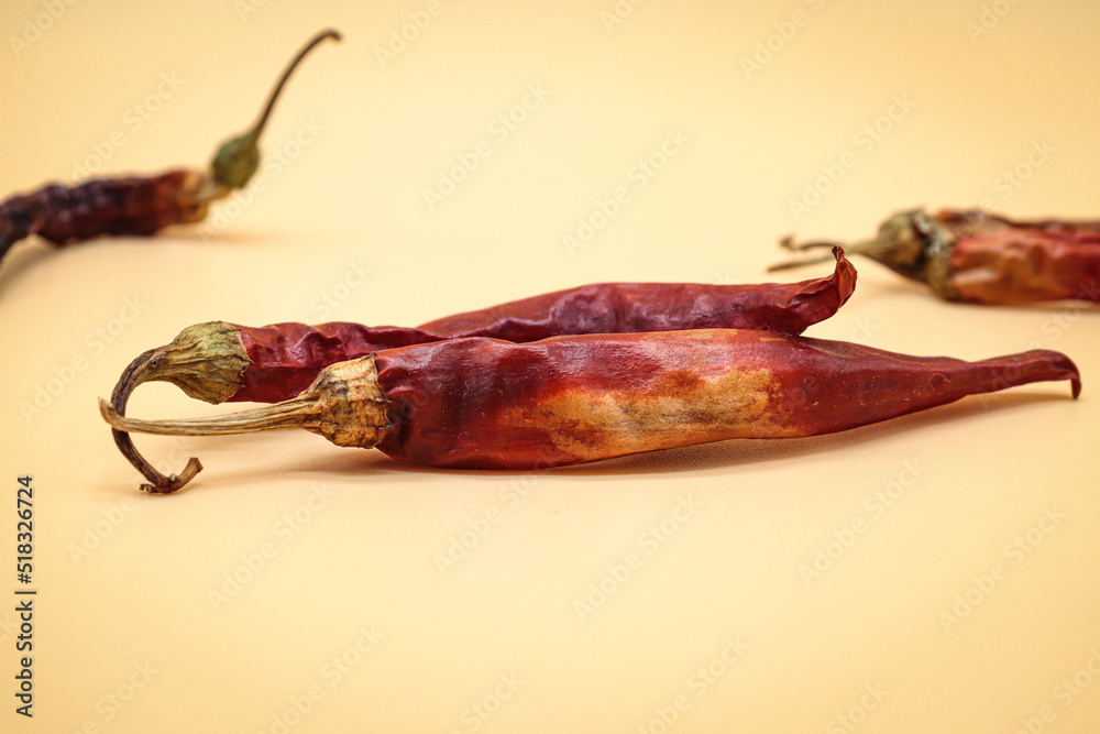 dried chillies on orange background dried chillies on orange background