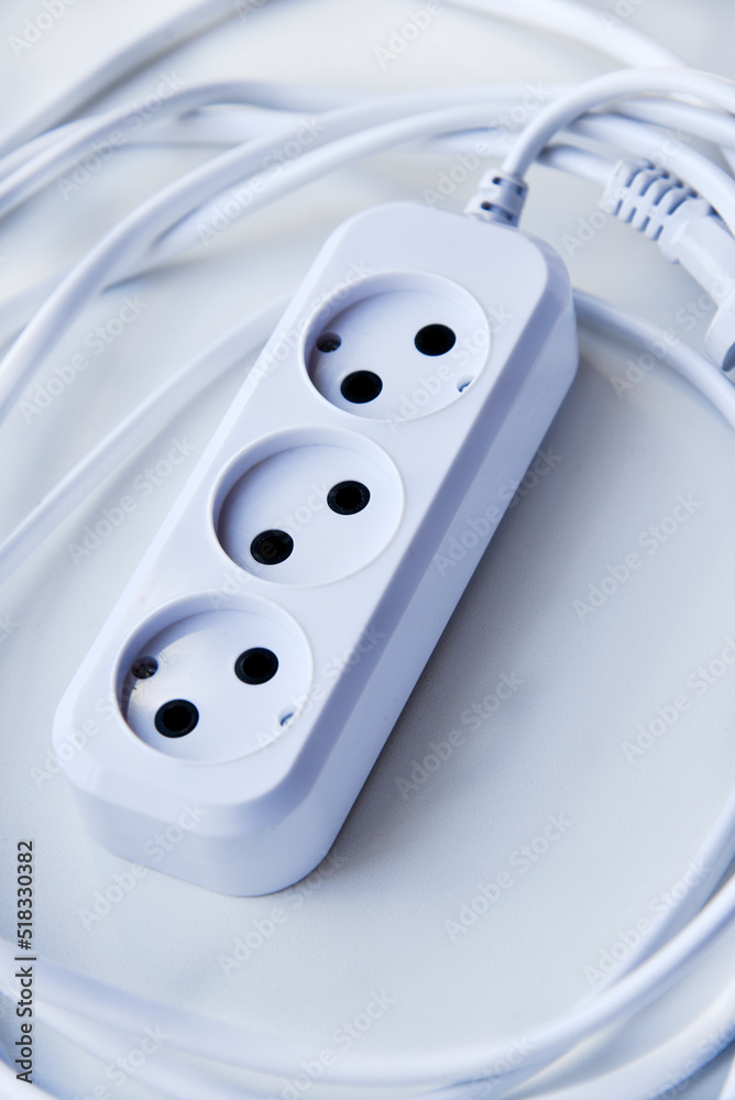White electric extension cord, great design for any purposes. White background. White electric extension cord, great design for any purposes. White background.