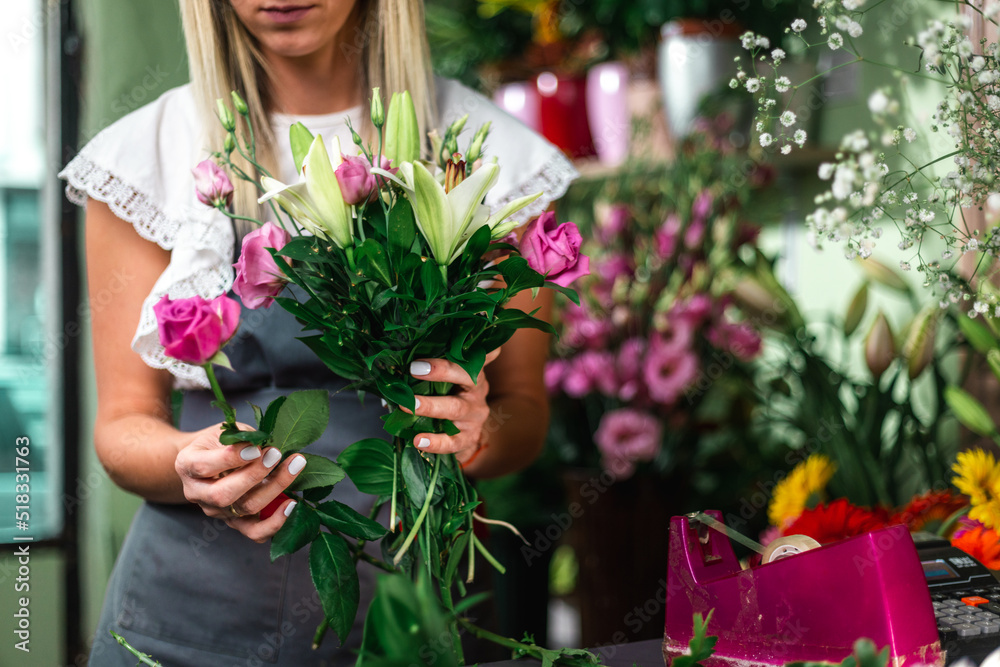 Gardener's in the flower shop make bouquet for a holiday. Family flower's business. Lifestyle flower shop. Beautiful flower composition. Detail. Close up.. Gardener's in the flower shop make bouquet for a holiday. Family flower's business. Lifestyle flower shop. Beautiful flower composition. Detail. Close up..