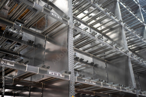 Empty warehouse ineterior with industrial racks pallets shelves. Warehouse background photo