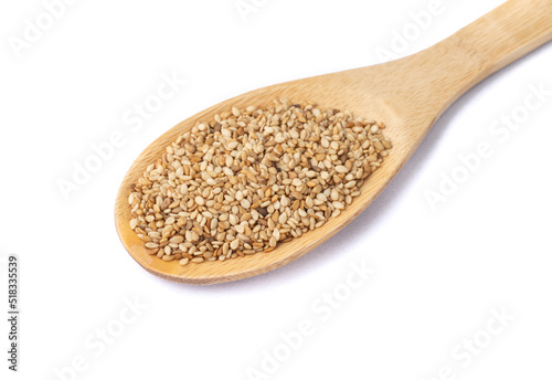 Sesame seeds in a spoon isolated over white background