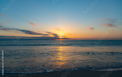 beautiful sunset with sea water on the summer beach. freedom