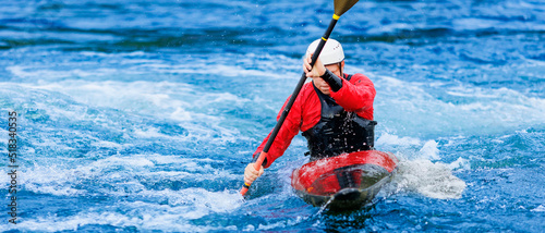 Extreme water sports, rafting on mountain river in kayak. Kayaker man strives for victory, boating championship © Parilov