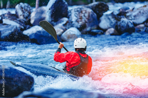 Extreme water sports, rafting on mountain river in kayak. Kayaker man strives for victory, boating championship © Parilov