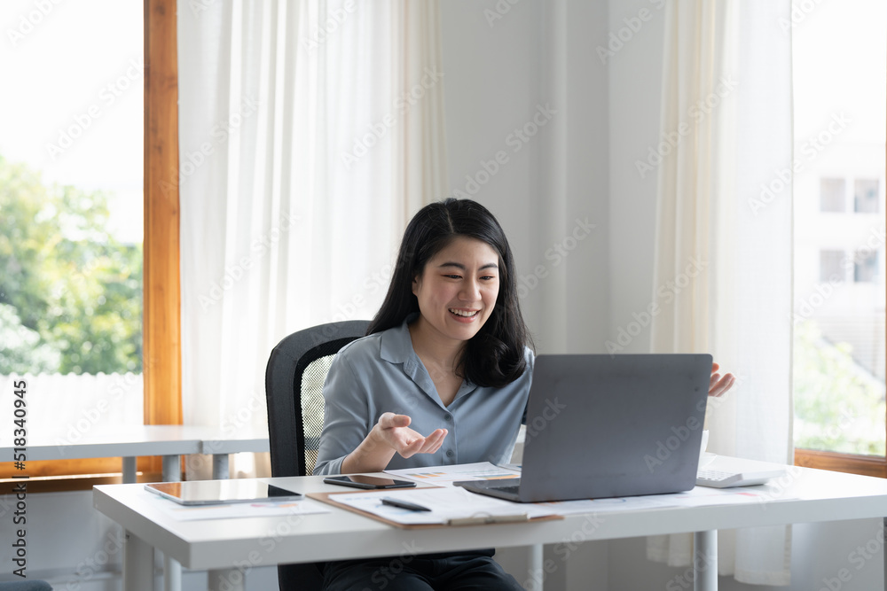 Business asian woman working remotely video calling with laptop at her home. Business asian woman working remotely video calling with laptop at her home.