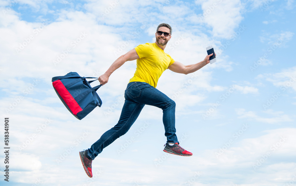 Active guy running with sporty bag midair sky background, sport Active guy running with sporty bag midair sky background, sport
