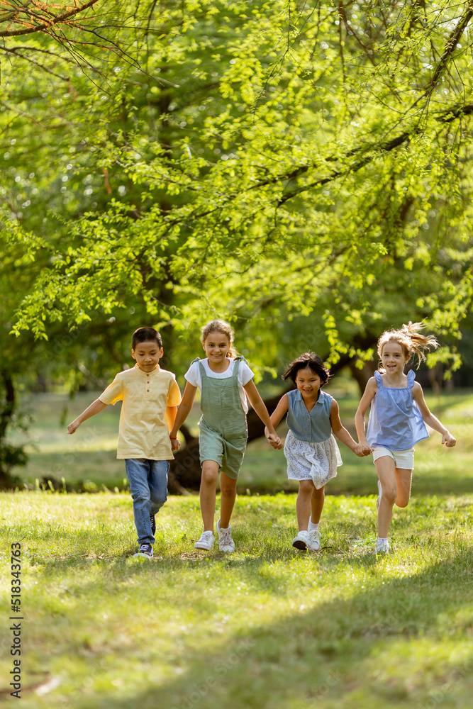 Group of asian and caucasian kids having fun in the park Group of asian and caucasian kids having fun in the park