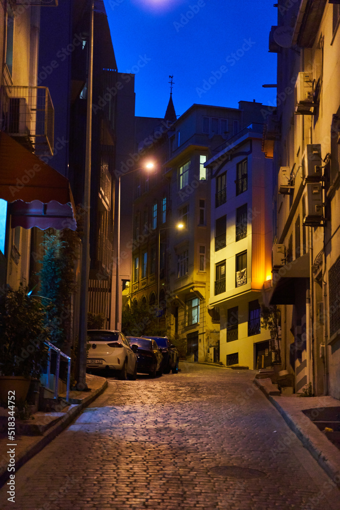 Istanbul, Turkey - May 2, 2021: Night view of a narrow old street in Istanbul, Turkey