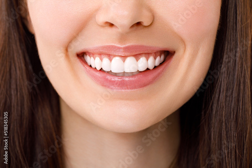 A beautiful woman is smiling. a smile with white teeth. Close up image.