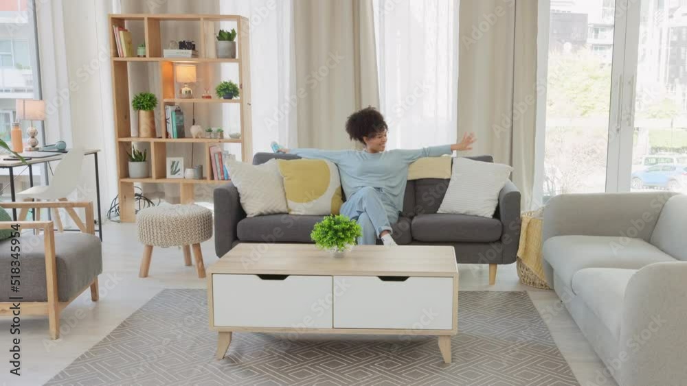 African American female spring cleaning in fast motion, sitting and taking a break after completing her chores. Time lapse of a black woman relaxing on the sofa after cleaning her apartment.