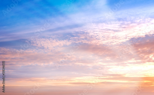 Copy space and beautiful sunset sky with wispy clouds and sun rays shining through vibrant colour with heaven and religious theory. Scenic view of peaceful  calm and serene atmosphere and ozone layer