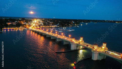 Bridge of Lions, in St. Augustine Fl. at night with a full moon in the background. 