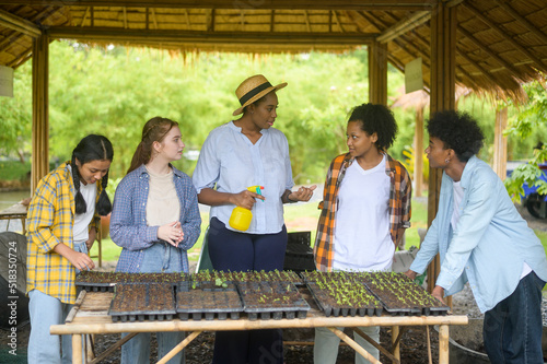 Group of mixed race students and teacher learning agriculture technology in smart farming , education ecology agricultural concepts .