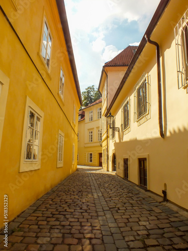 Yellow Buildings in Prague Alley, the Old City, Praha Narrow Street with cobblestones, Alleyway Medieval Street, Jewish Quarter, Czech Republic