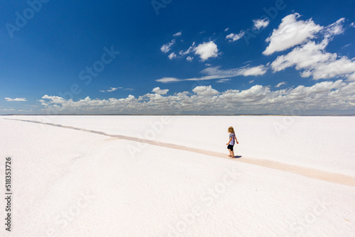 little girl walks on the tuz golu salt lake.