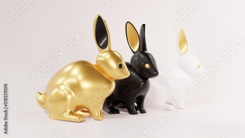 Three lovely ceramic bunny ornaments with golden ears. Animal characters gold, black and white. Realistic 3d illustration on white background. Year of the rabbit according to the Chinese zodiac.