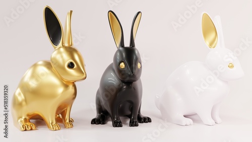 Three lovely ceramic bunny ornaments with golden ears. Animal characters gold, black and white. Realistic 3d illustration on white background. 2023 Year of the rabbit according to the Chinese zodiac.