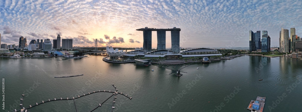 Fototapeta premium Aerial View of The Picturesque Marina Bay Sands Casino and Hotel, The Shoppes, Singapore Flyer and the Art MuseumAerial View of The Picturesque Marina Bay Sands Casino and Hotel, The Shoppes, Singapor