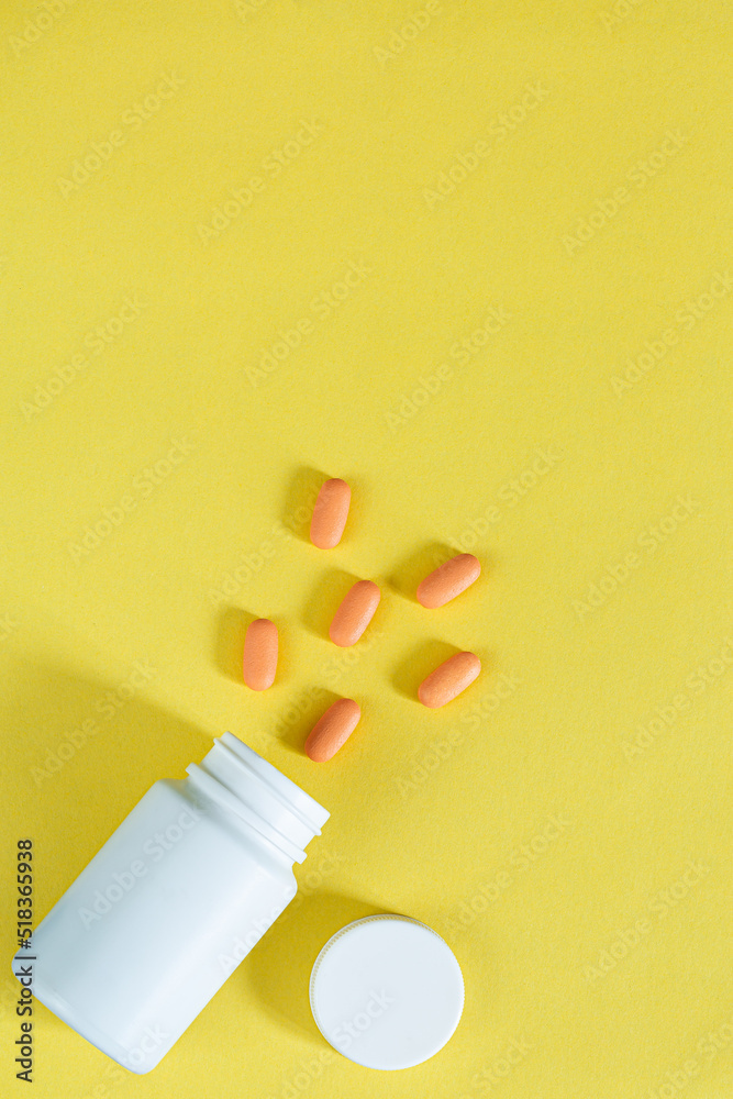 Pills and pill bottles on yellow background,Multicolor tablets and pills capsules from glass bottle on yellow background Heap of assorted various medicine tablets and pills. Health care Close-up Copy Pills and pill bottles on yellow background,Multicolor tablets and pills capsules from glass bottle on yellow background Heap of assorted various medicine tablets and pills. Health care Close-up Copy