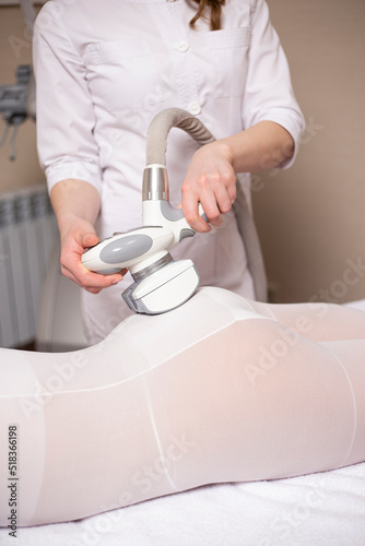 A woman having anti cellulite massag treatment at beauty spa salon.