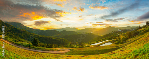 panoramic view of mountains and sky Forested hills in rising fog. Mountain sunset hills.