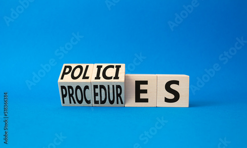 Policies and Procedures symbol. Turned wooden cubes with words Policies and Procedures. Beautiful blue background. Business and Policies and Procedures concept. Copy space