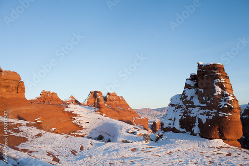Tall red rocks in a snowy landscape Goblin Valley photo