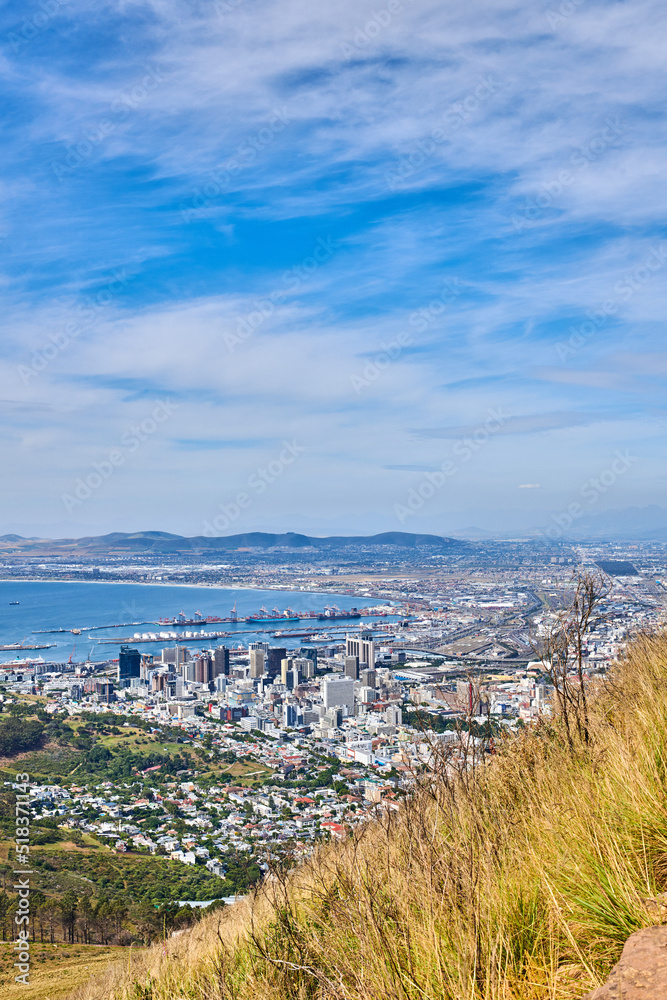 Landscape view of the city of Cape Town in South Africa. Beautiful scenic view of a popular tourist town with greenery and nature during summer. Ocean and residential in the Western Cape
