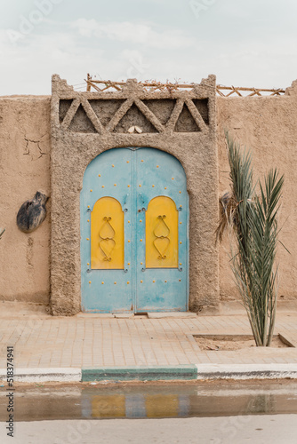Moroccan entry gate of Kasbah in Merzouga photo
