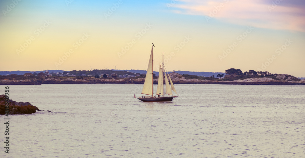 Ship Sailing at Sunset