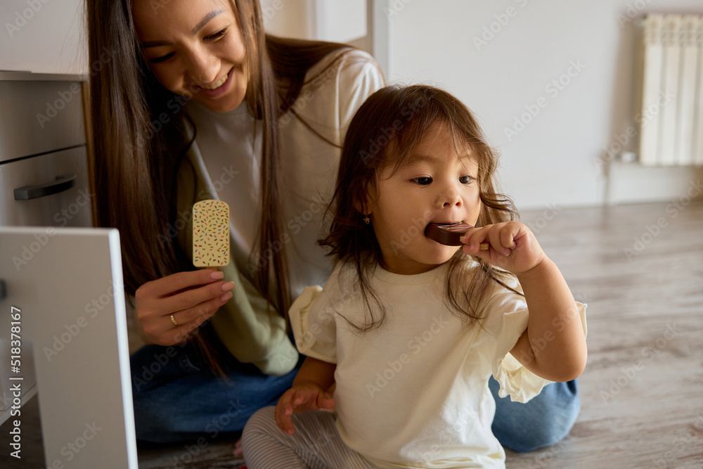 little asian girl playing with her toys and a small car little asian girl playing with her toys and a small car