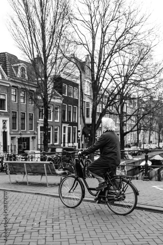 Ingontito person riding on bike in ancient city photo