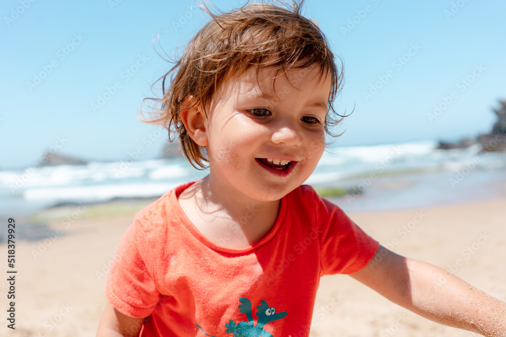 Happy little girl on beach portrait Happy little girl on beach portrait